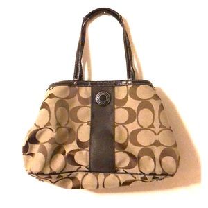 Coach shoulder bag, with inside, center wallet.